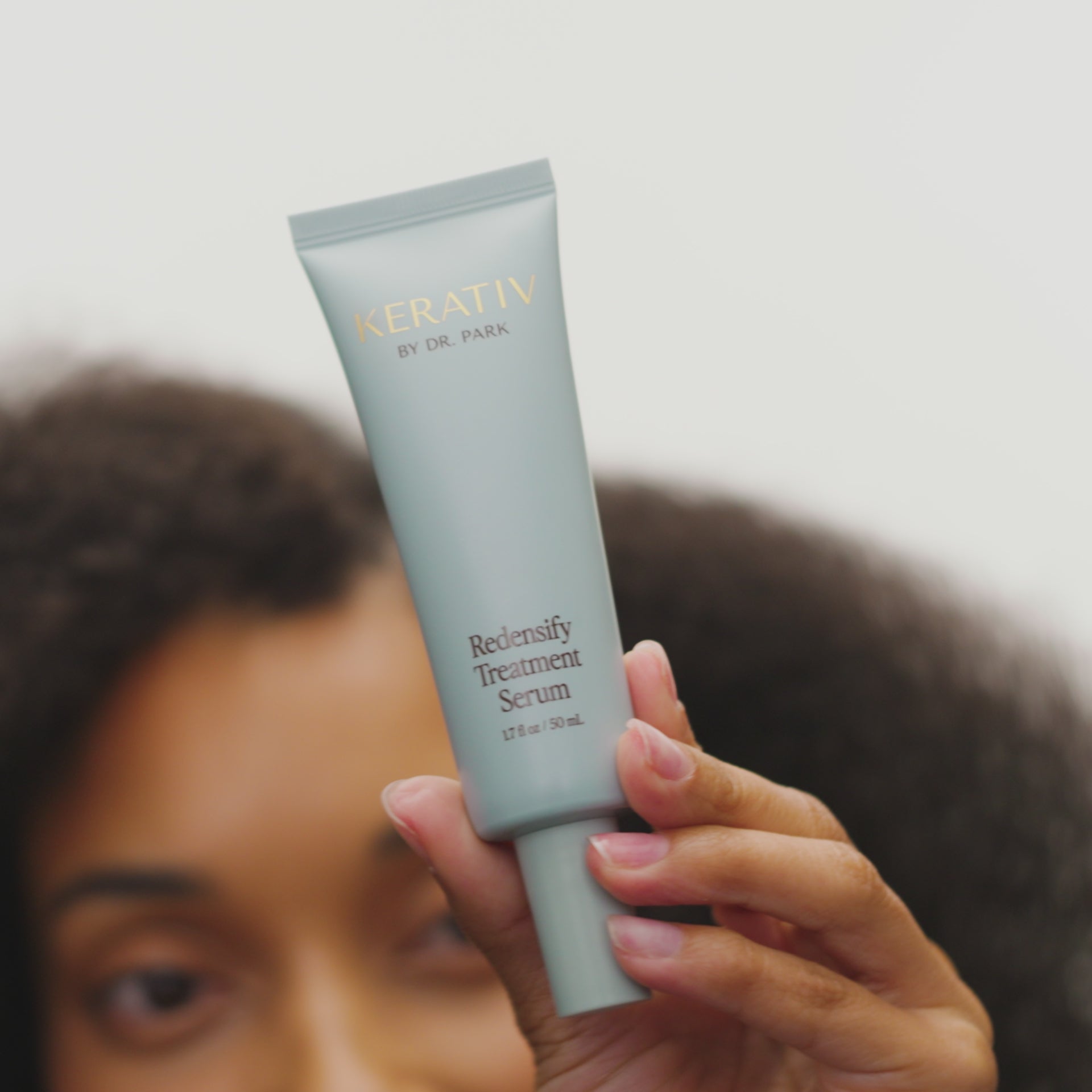 Video of a woman and a man applying Kerativ Rdensify Treatment Serum